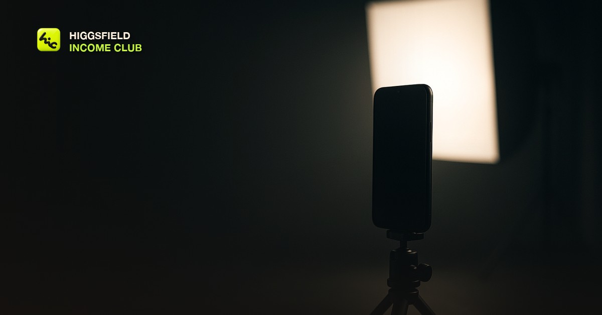 A phone mounted vertically on a small tripod facing a glowing softbox in a dim studio, moody cinematic light