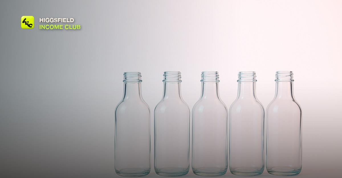 A row of identical clear glass bottles on a seamless white sweep under one large softbox, with a faint color shift running across them